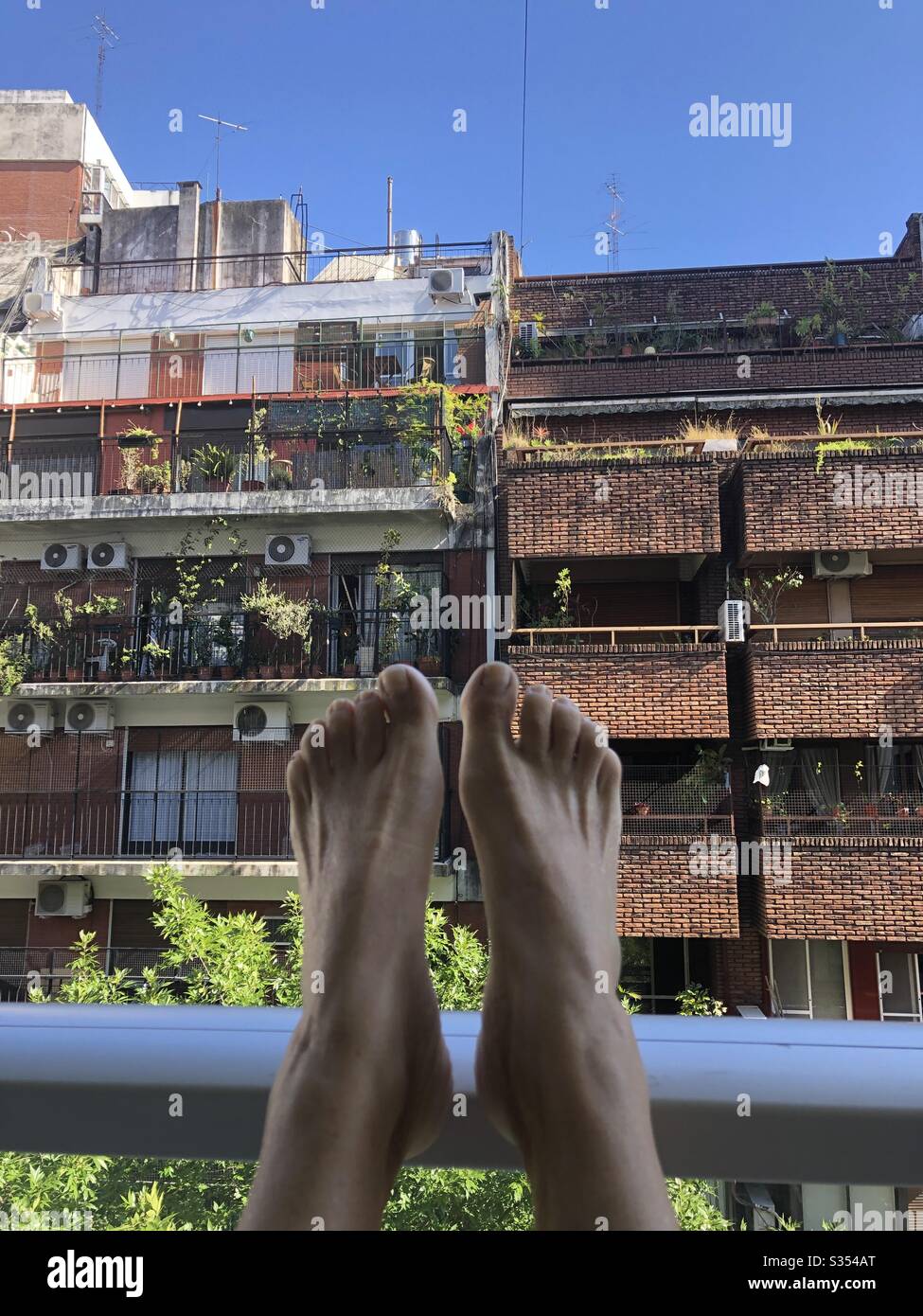 Relaxing on the balcony in Buenos Aires during quarantine 2020. Stock Photo