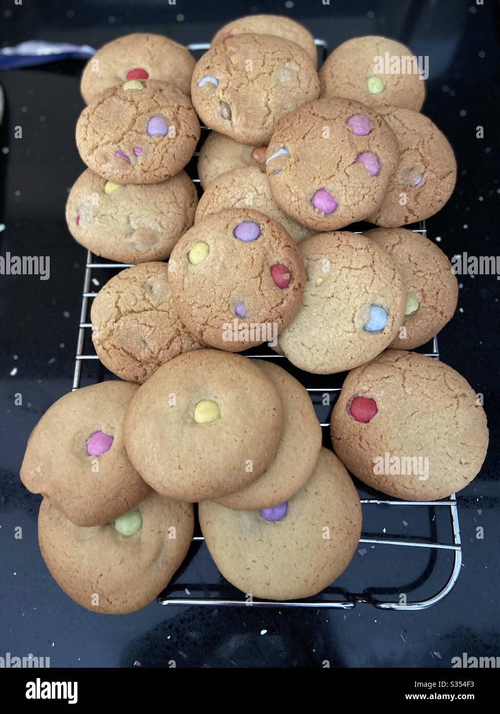 With COVID19 causing havoc, we indulged in home baking and baked these beautiful smarties themed cookies. Stock Photo