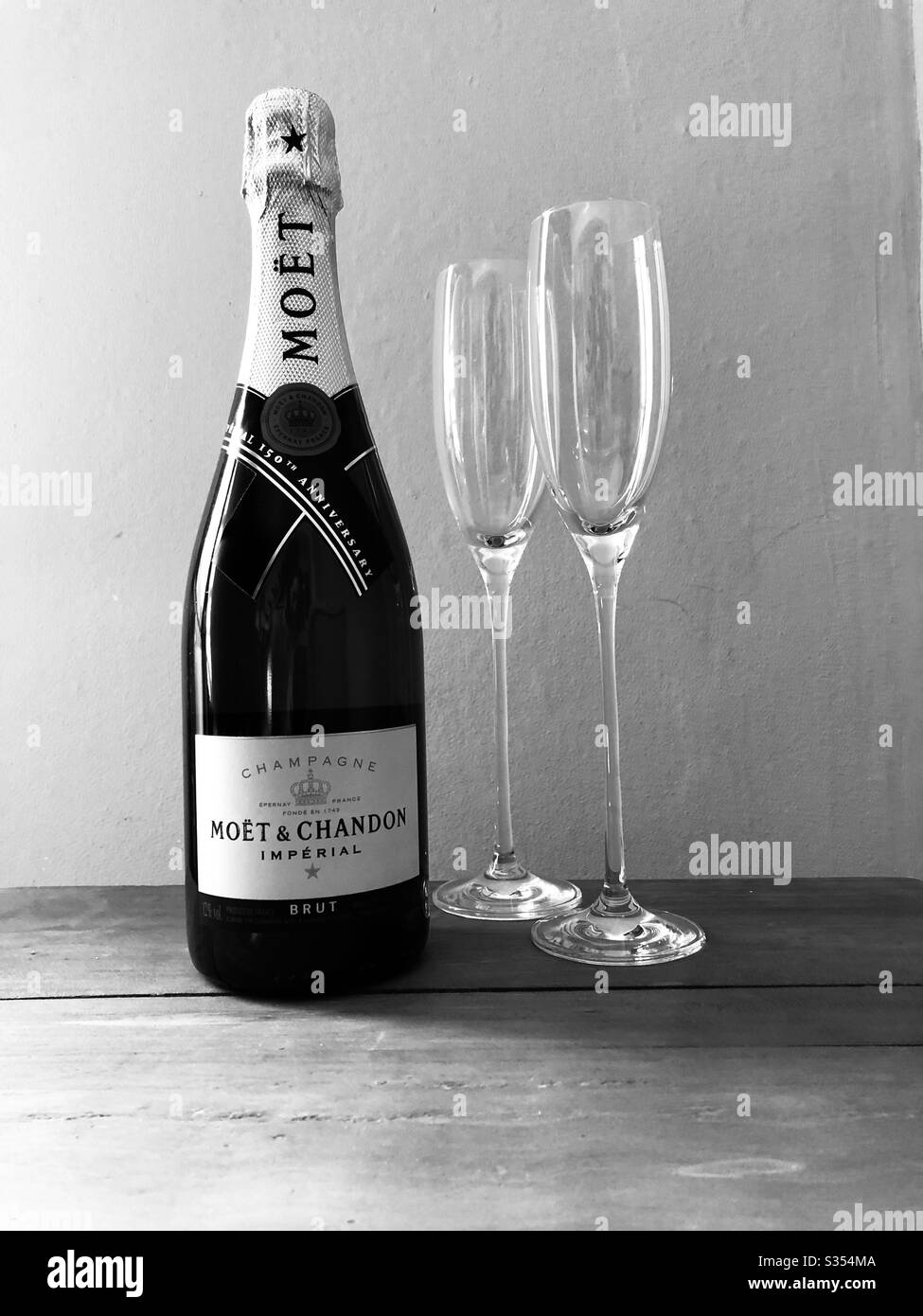 Bottle of Moët Champagne with two Champagne Flutes Stock Photo
