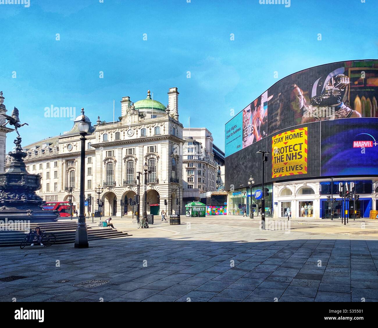 Piccadilly Circus under lockdown during Covid 19 pandemic. Easter bank holiday weekend. London UK - Smartphone Captured Stock Image