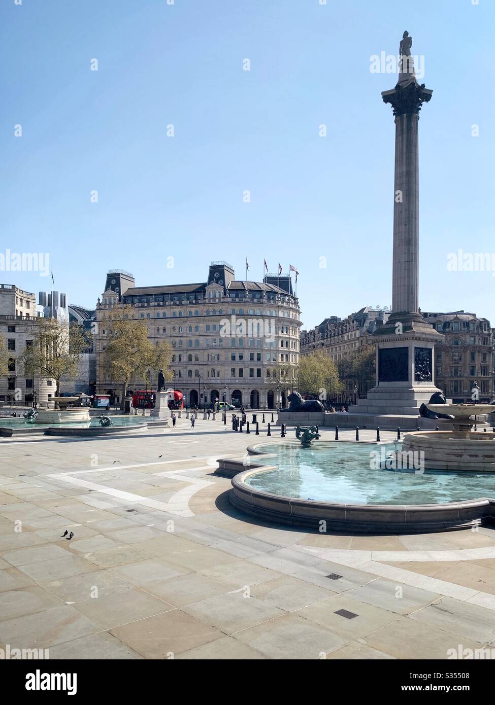 Trafalgar Square during lockdown due to covid 19 pandemic. Easter bank holiday weekend. London, UK - Smartphone Captured Stock Image