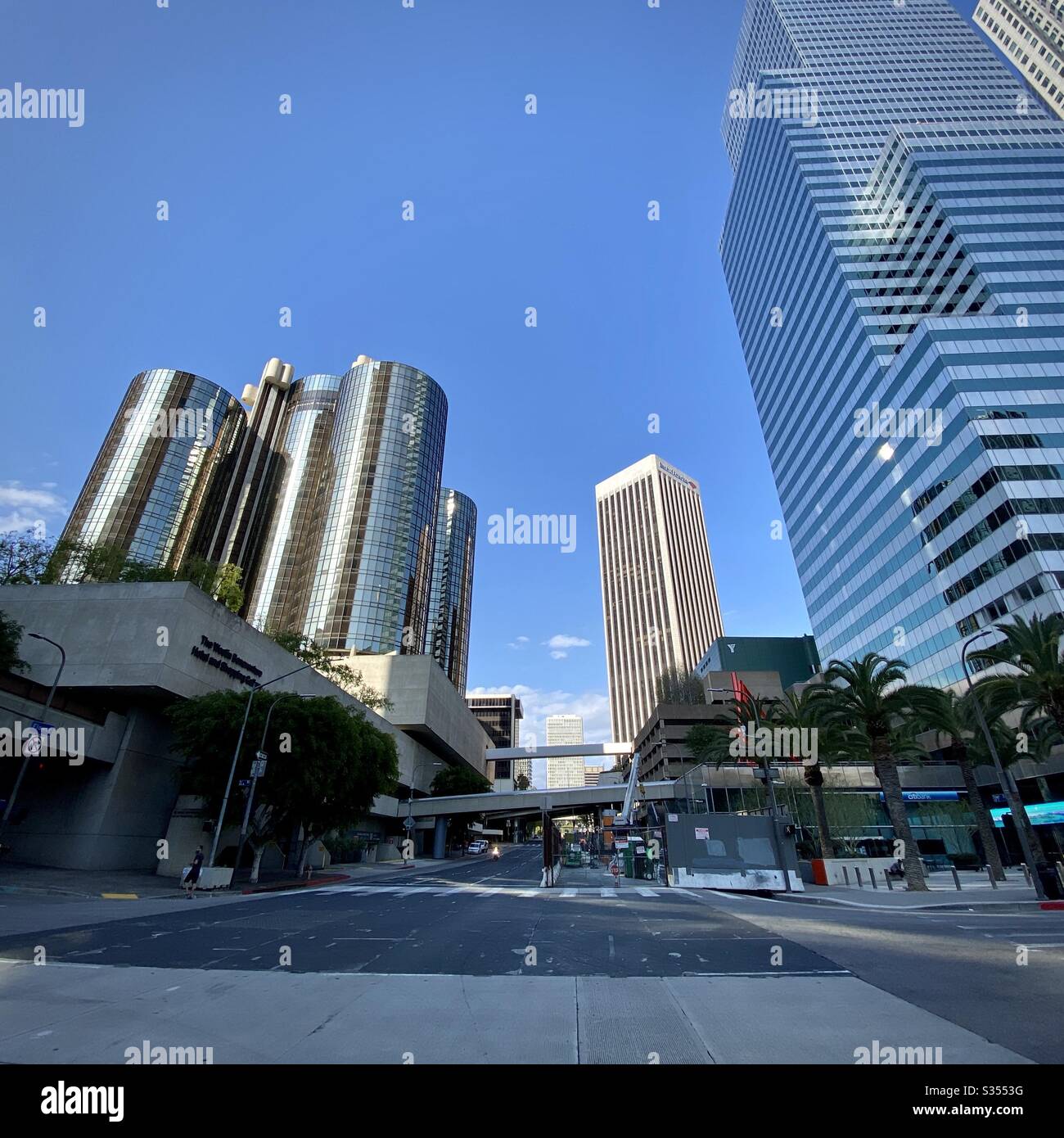 LOS ANGELES, CA, MAR 2020: view North on Flower St in Downtown, Westin Bonaventure hotel on left, work on new LA Metro regional connector directly ahead, office skyscrapers on right - Smartphone Captured Stock Image