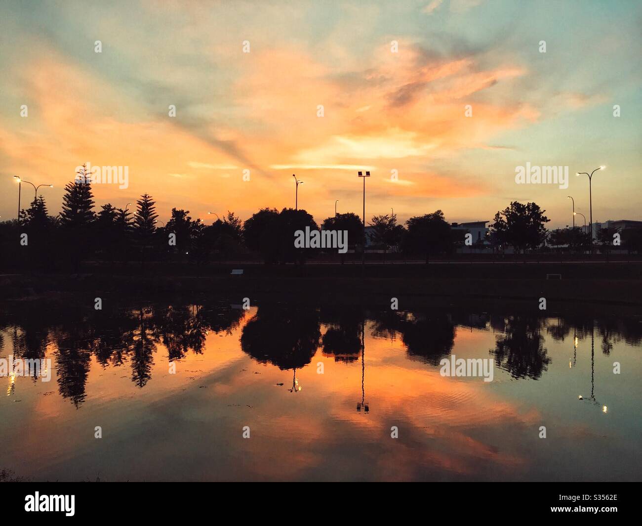 Sunset reflection on water Stock Photo - Alamy