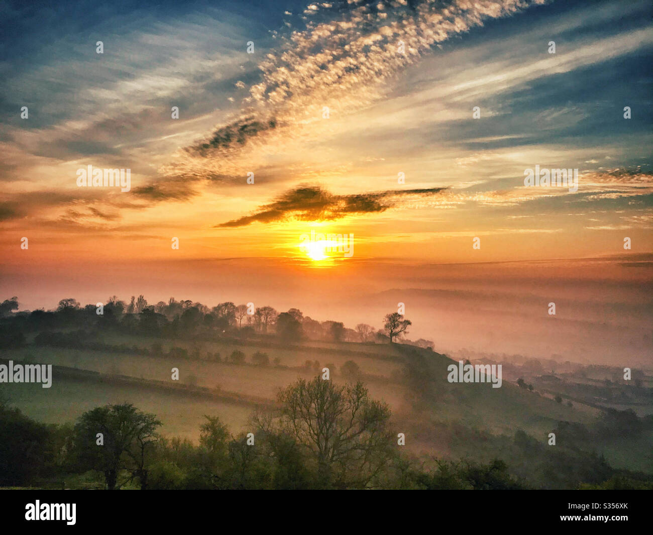 Sunrise on Glastonbury Tor, Somerset. Easter Sunday 2020 - Smartphone Captured Stock Image