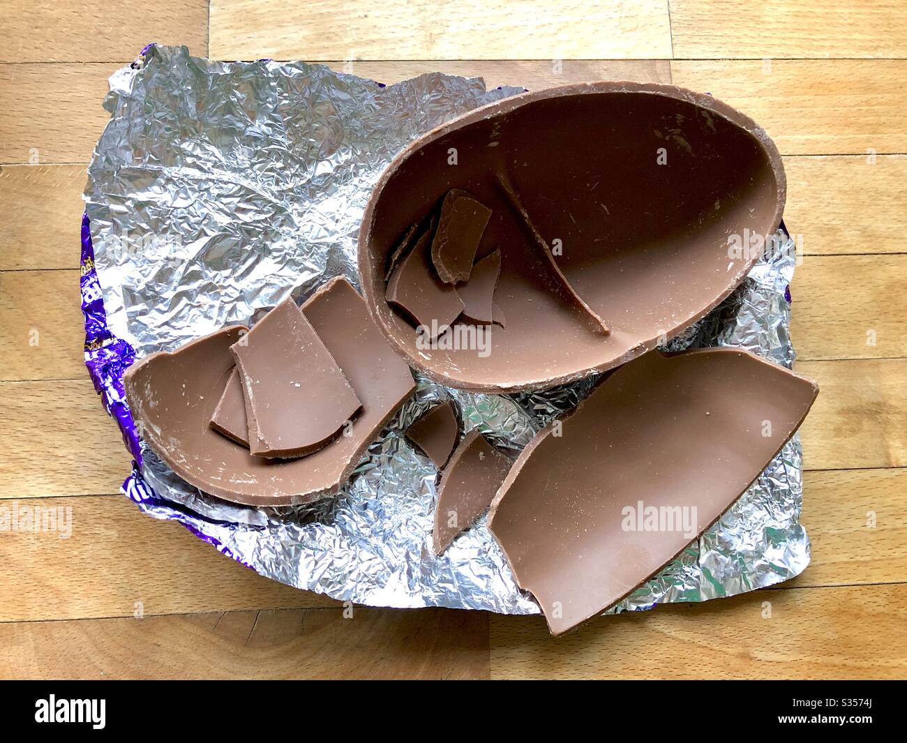 Broken Easter Egg on foil Stock Photo