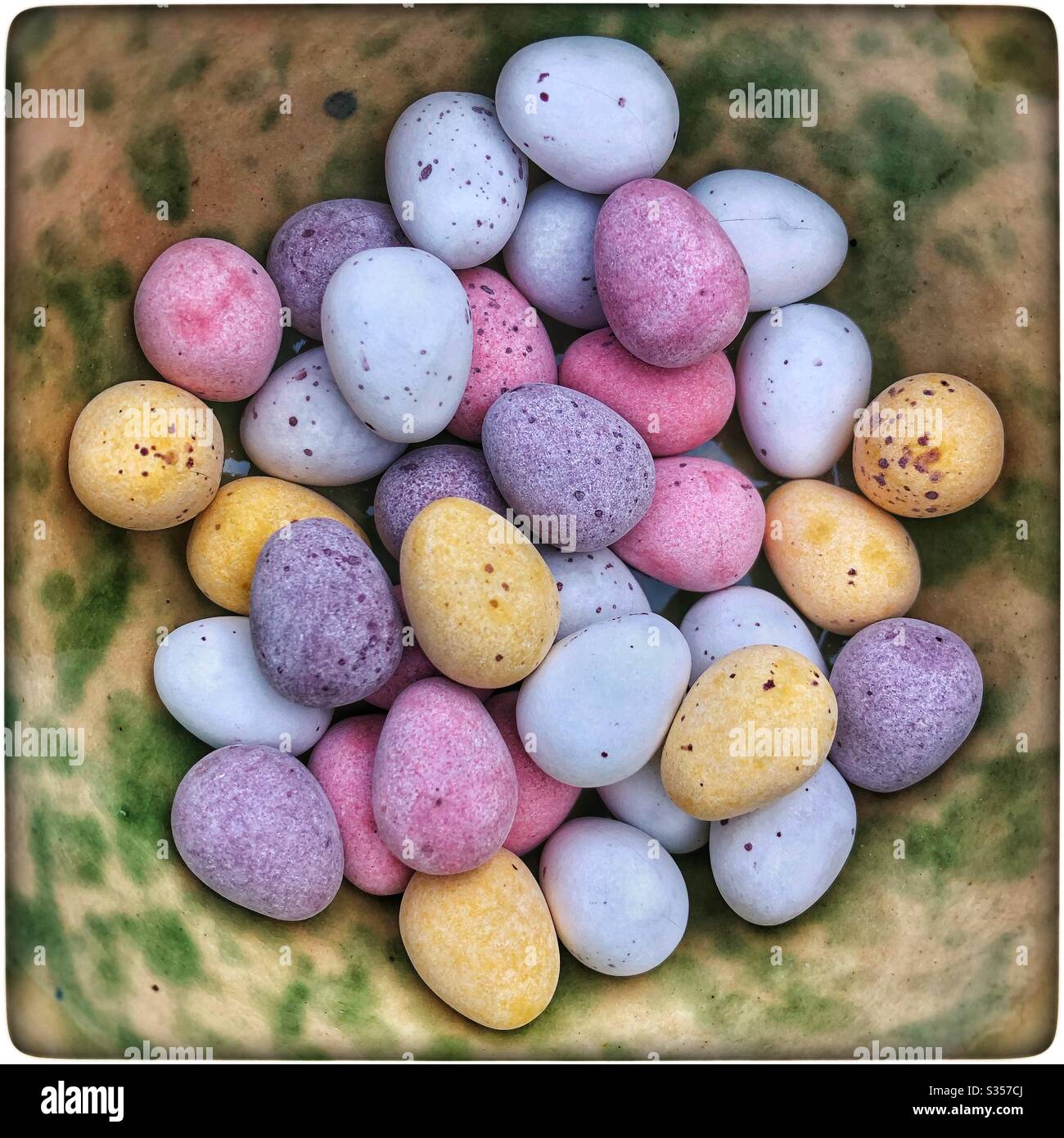 Closeup of chocolate mini Easter eggs in a bowl. - Smartphone Captured Stock Image