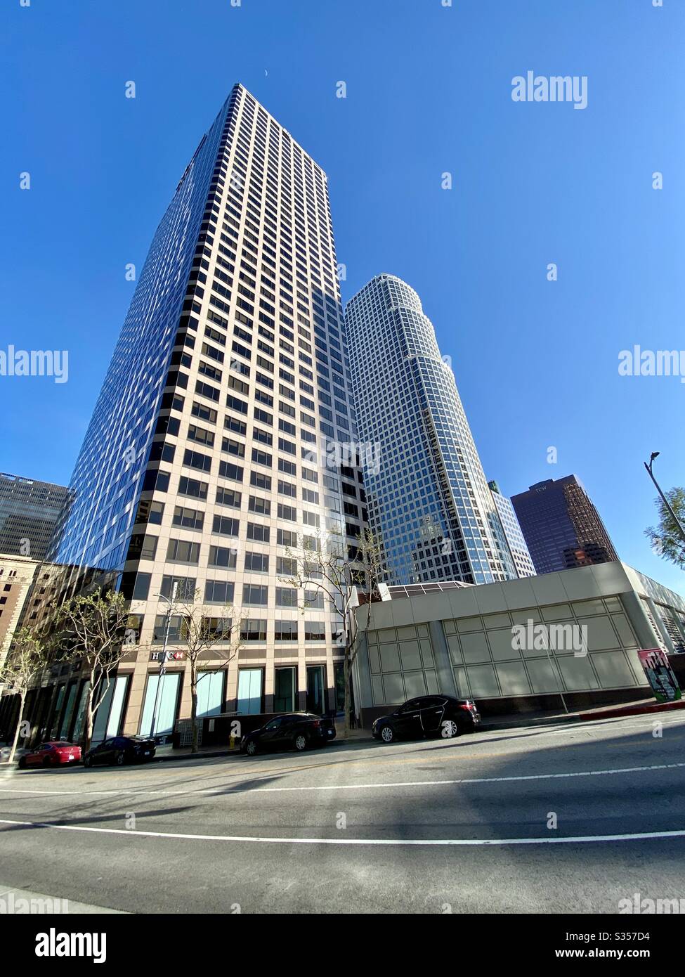 LOS ANGELES, CA, MAR 2020: skyscrapers on Figueroa St in Downtown, seen from 7th St, portrait view on a clear, sunny day - Smartphone Captured Stock Image