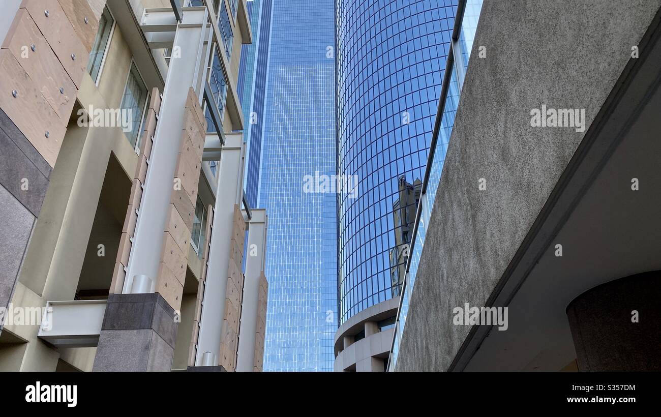 LOS ANGELES, CA, MAR 2020: detail of skyscraper offices and apartment buildings at California Plaza in Downtown on clear day with blue skies - Smartphone Captured Stock Image