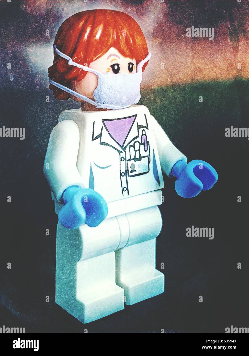 Doctor or nurse on the frontline fighting coronavirus covid-19.  Rubber gloves and protective face mask. - Smartphone Captured Stock Image