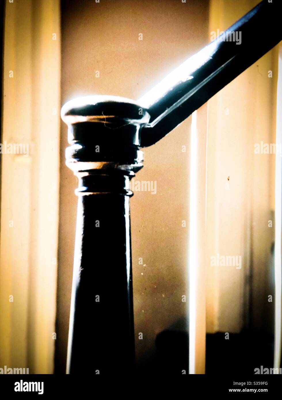 Bannister of home staircase provides stability in a home of other building - Smartphone Captured Stock Image