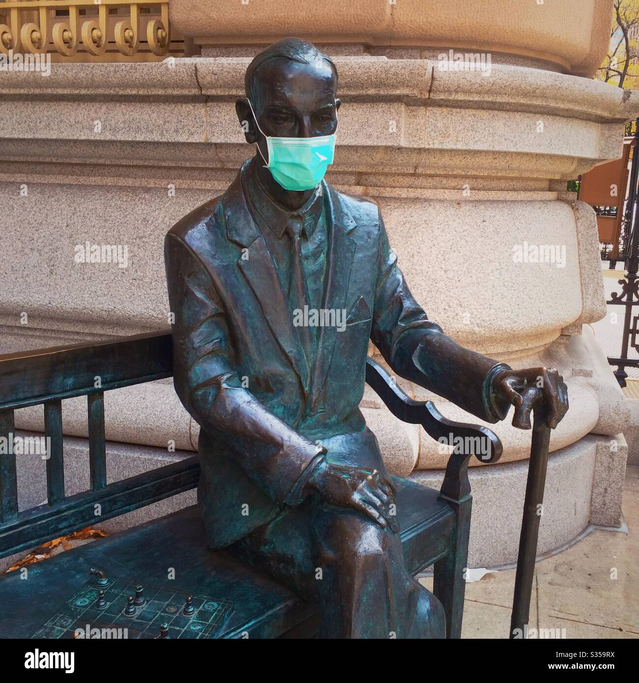 Statue of Lech Kaczynski wearing a protective face mask during the coronavirus pandemic in midtown Manhattan, April 2020, NYC, USA - Smartphone Captured Stock Image