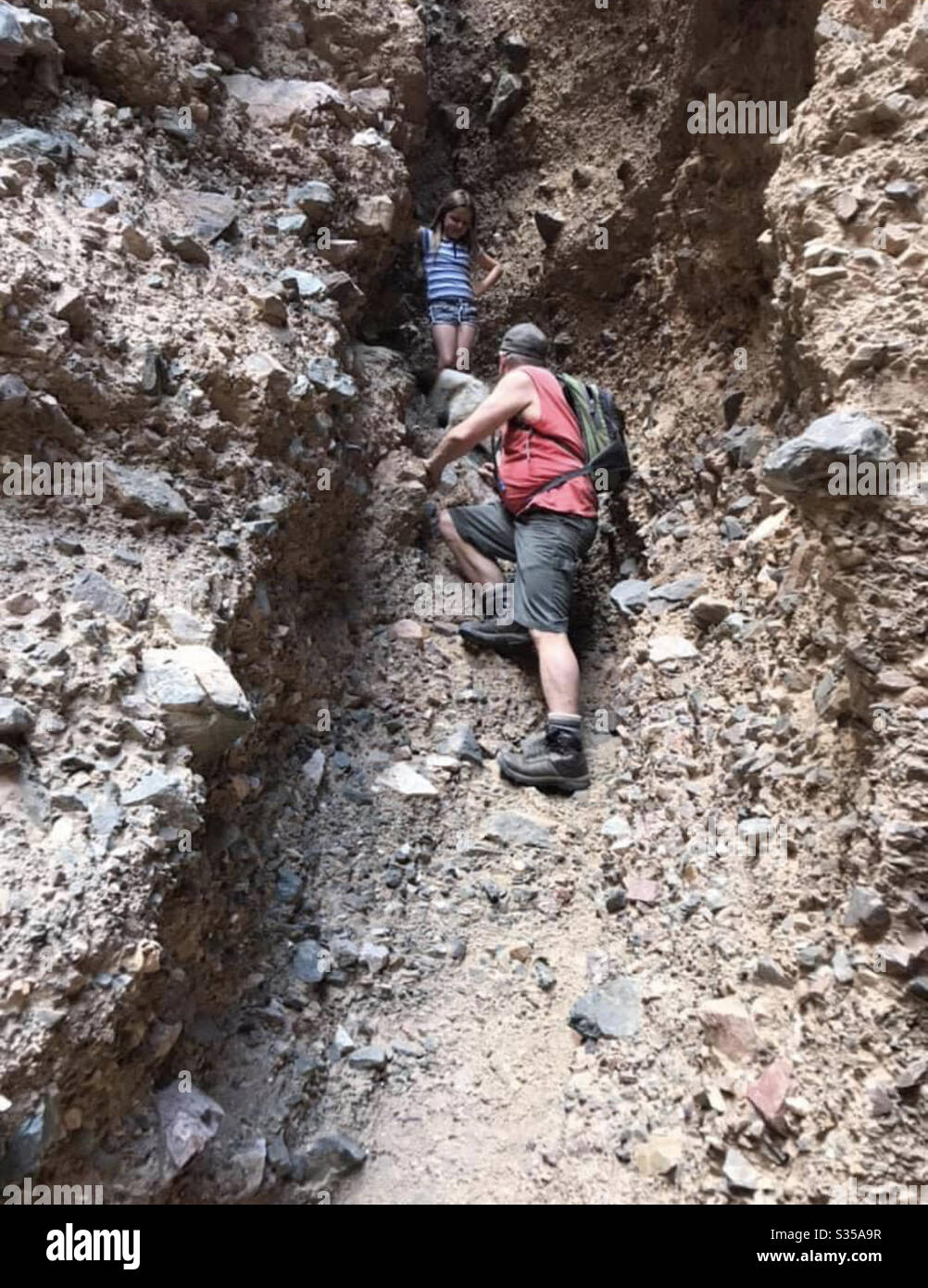 My husband and daughter in a slot canyon in Afton Canyon California Stock Photo