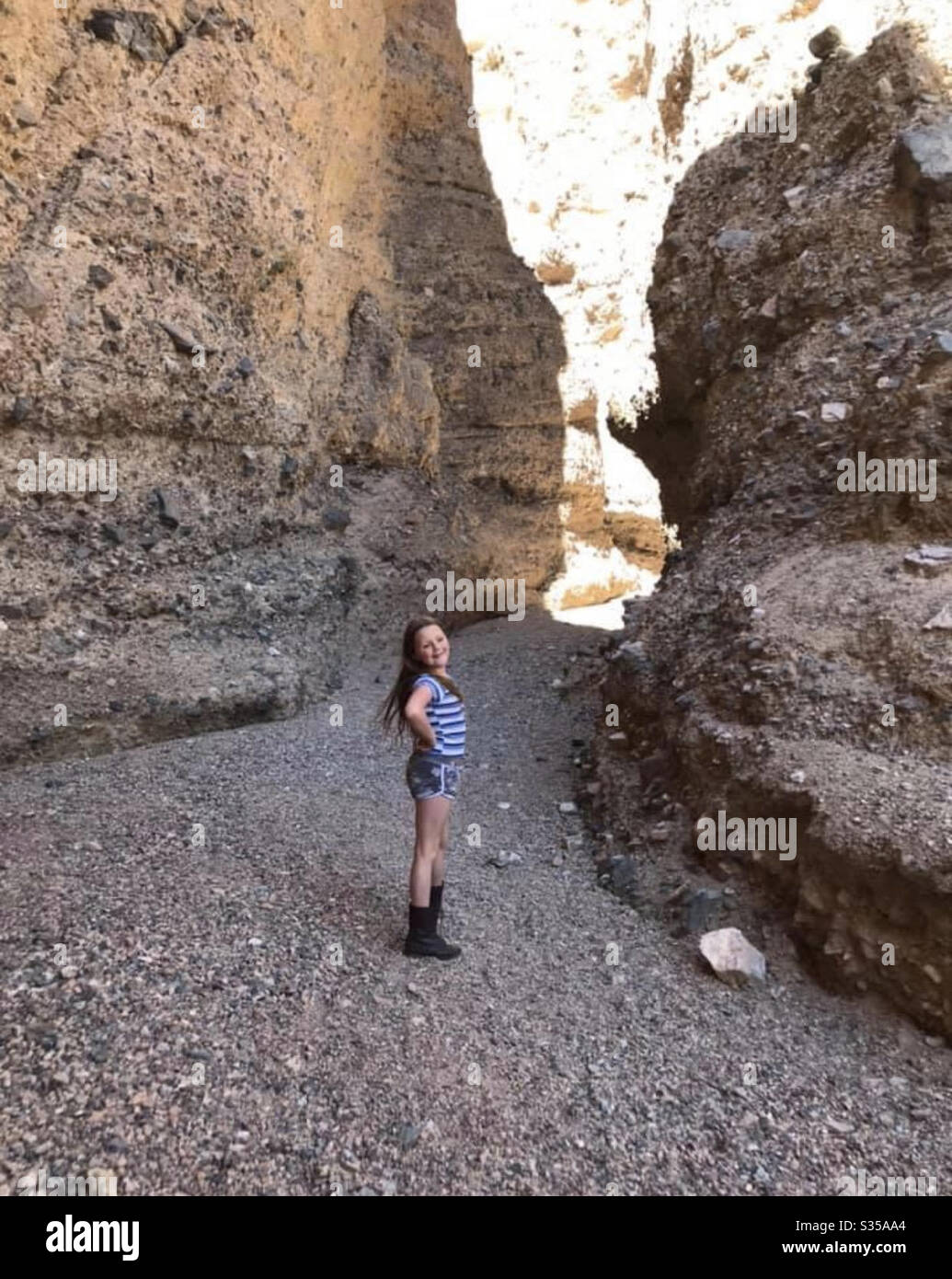 My daughter Cienna posing in front of the slot entrance in Afton Canyon California Stock Photo