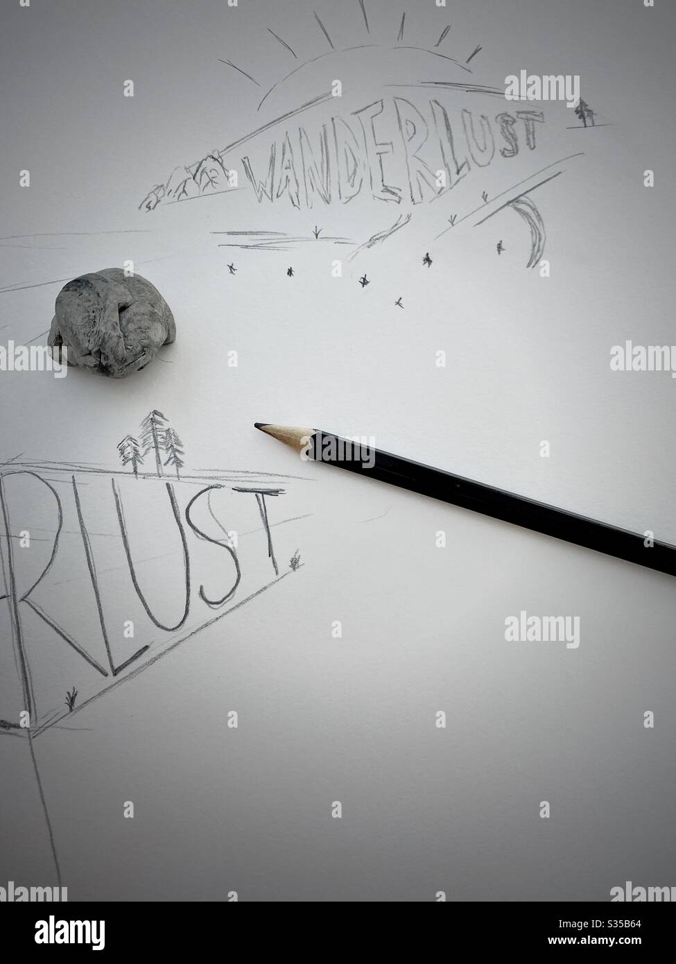 Close up view of my sketchbook. Practicing hand lettering and typography during a graphic design study session. Sketching and drawing. Wanderlust concept. Rough sketch on paper with pencil and eraser - Smartphone Captured Stock Image