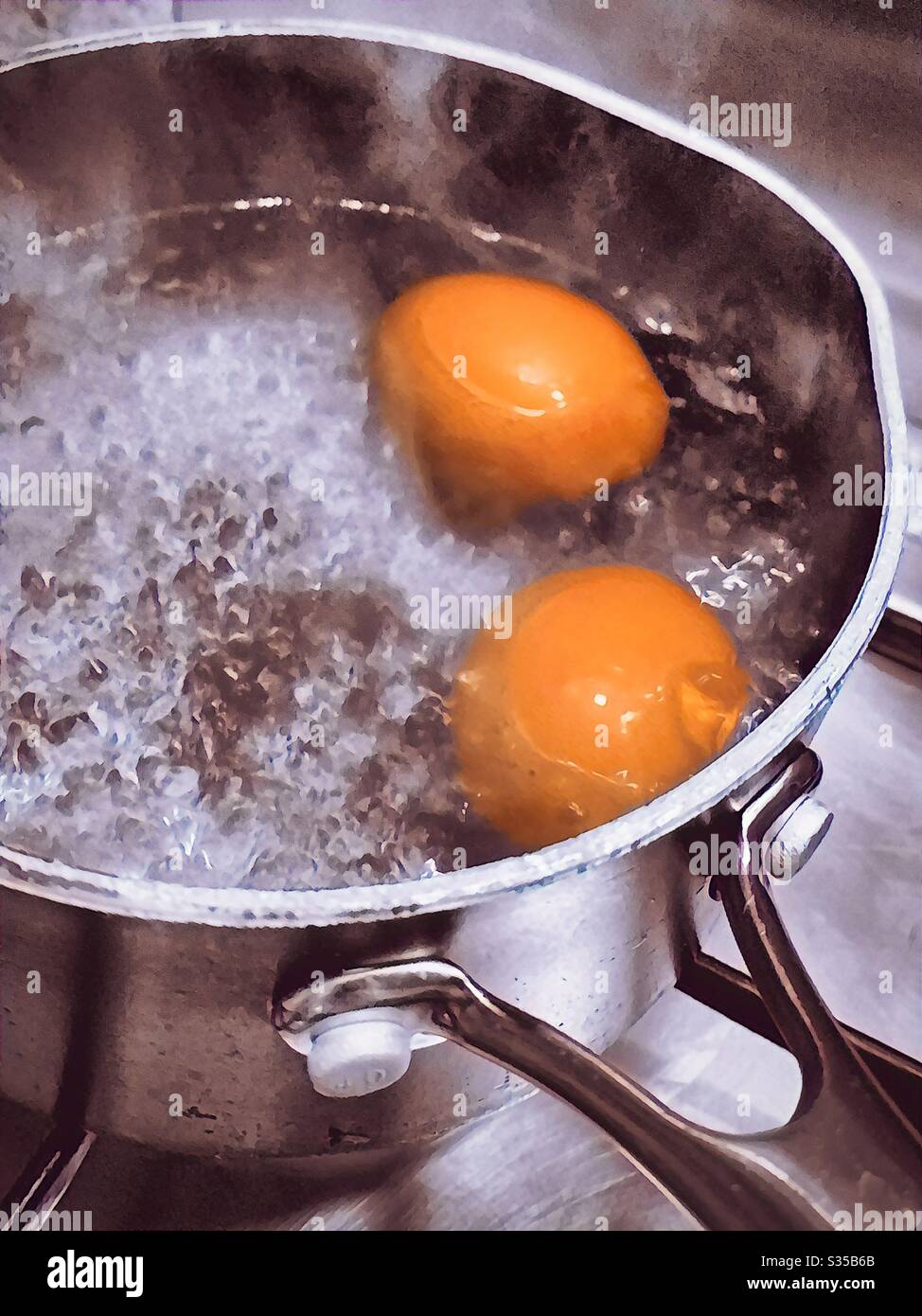 Two boiled eggs in a double egg cup Stock Photo - Alamy