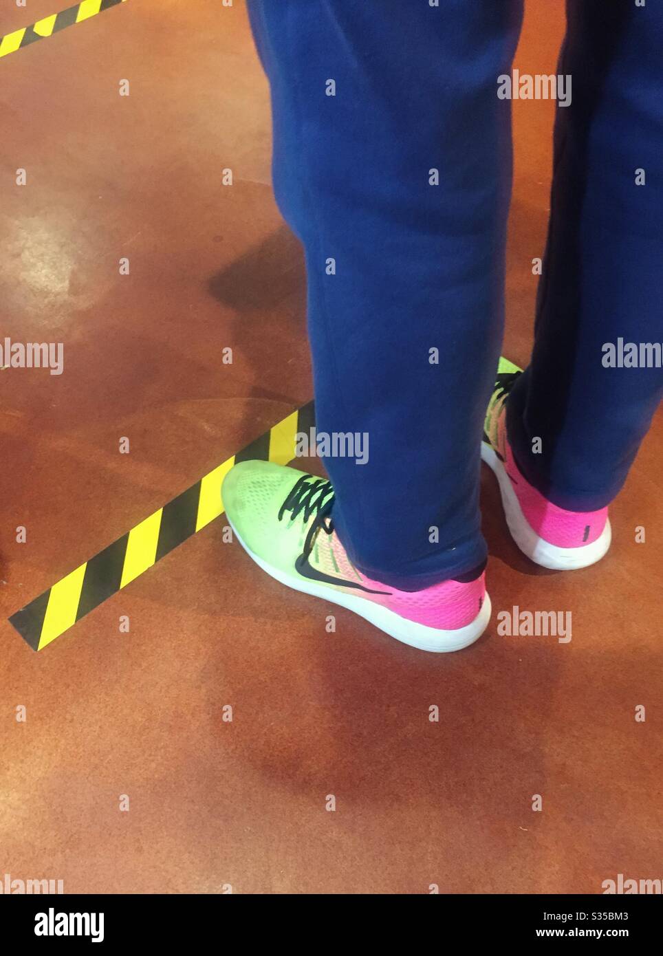 Social distancing marker in the aisle at the Eataly marketplace, April 2020, New York City, USA - Smartphone Captured Stock Image