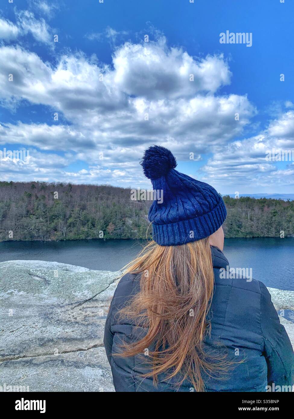 Woman at park social distancing on lonely cliff  New York State parks are free for quarantine - Smartphone Captured Stock Image