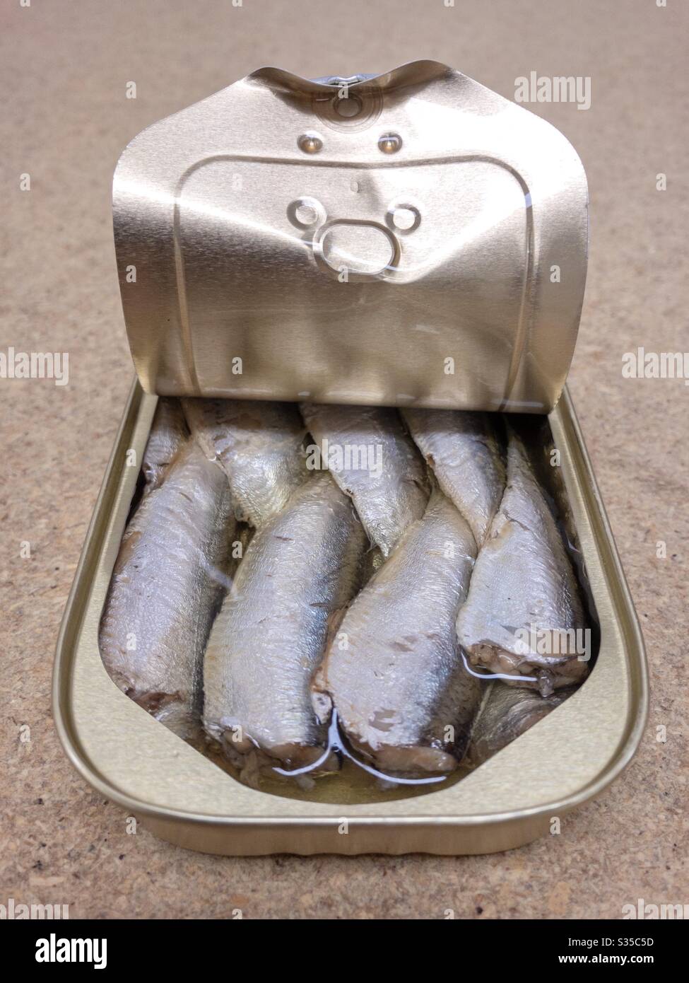 Opened tin of sardines in oil Stock Photo Alamy