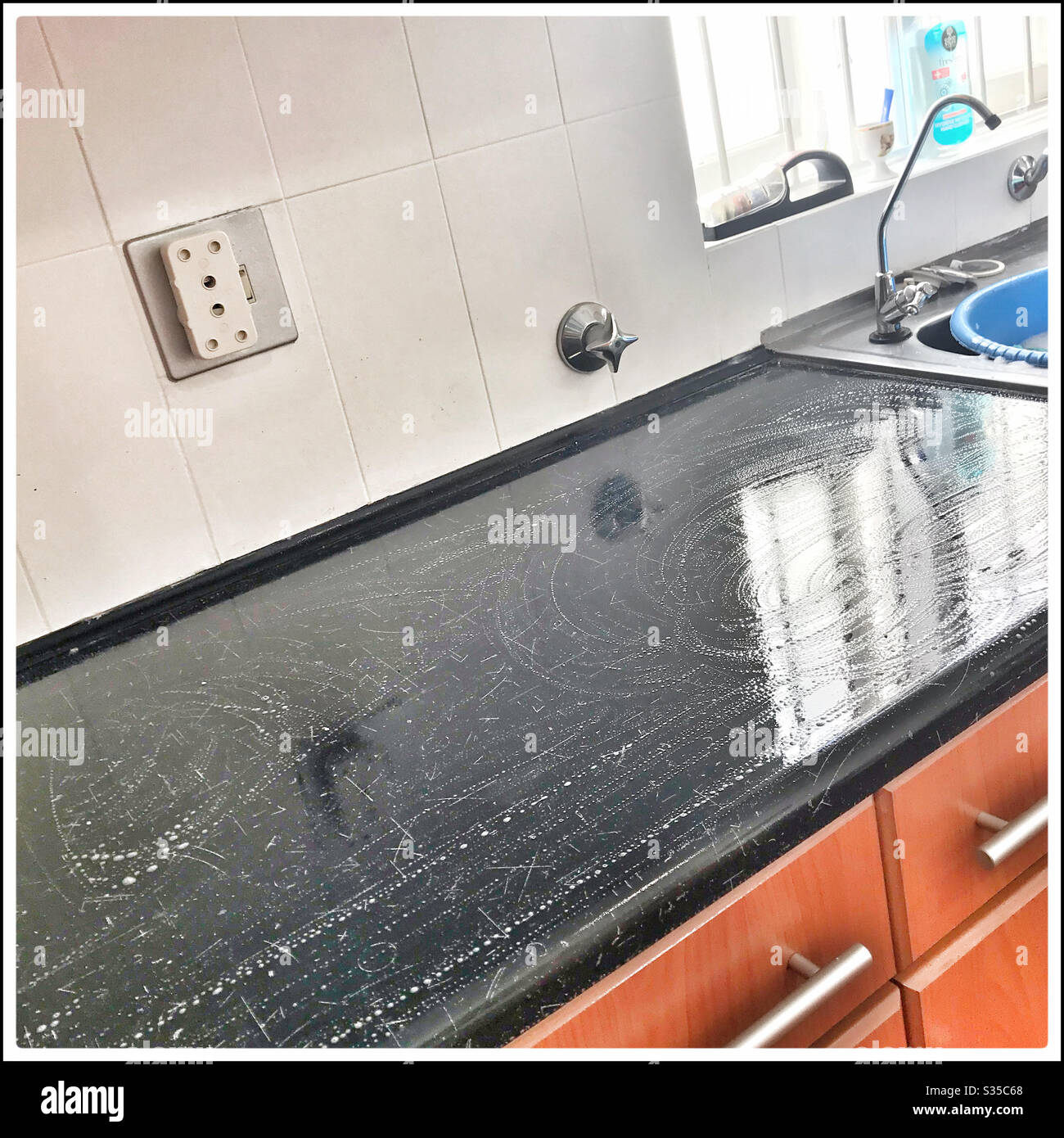 Deep cleaning kitchen during coronavirus lockdown. - Smartphone Captured Stock Image