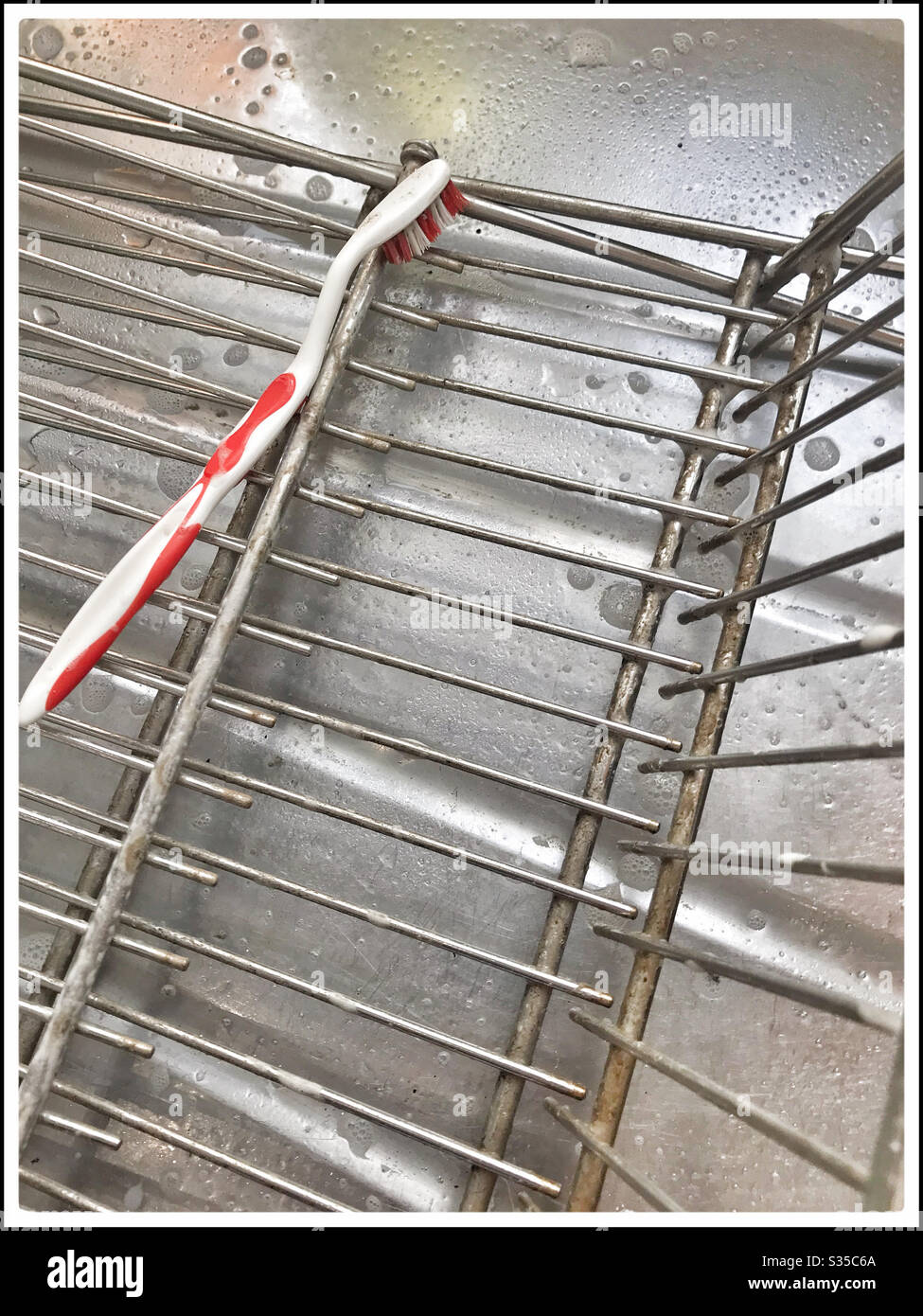 Deep cleaning kitchen during coronavirus lockdown. - Smartphone Captured Stock Image