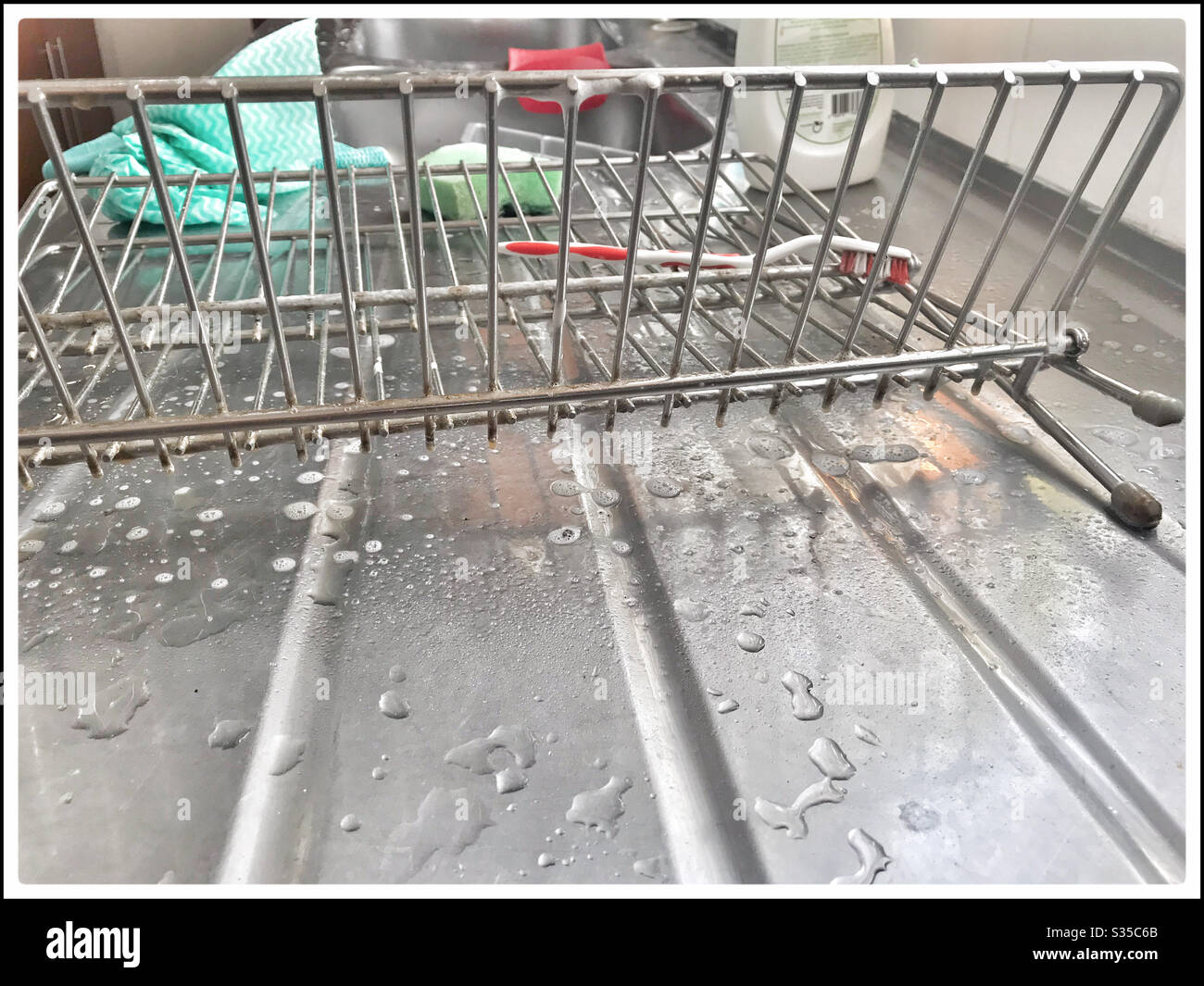 Deep cleaning kitchen during coronavirus lockdown. - Smartphone Captured Stock Image