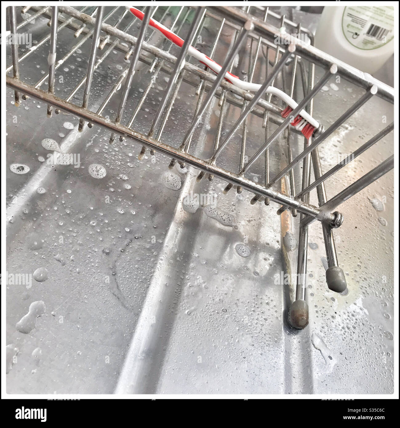 Deep cleaning kitchen during coronavirus lockdown. - Smartphone Captured Stock Image