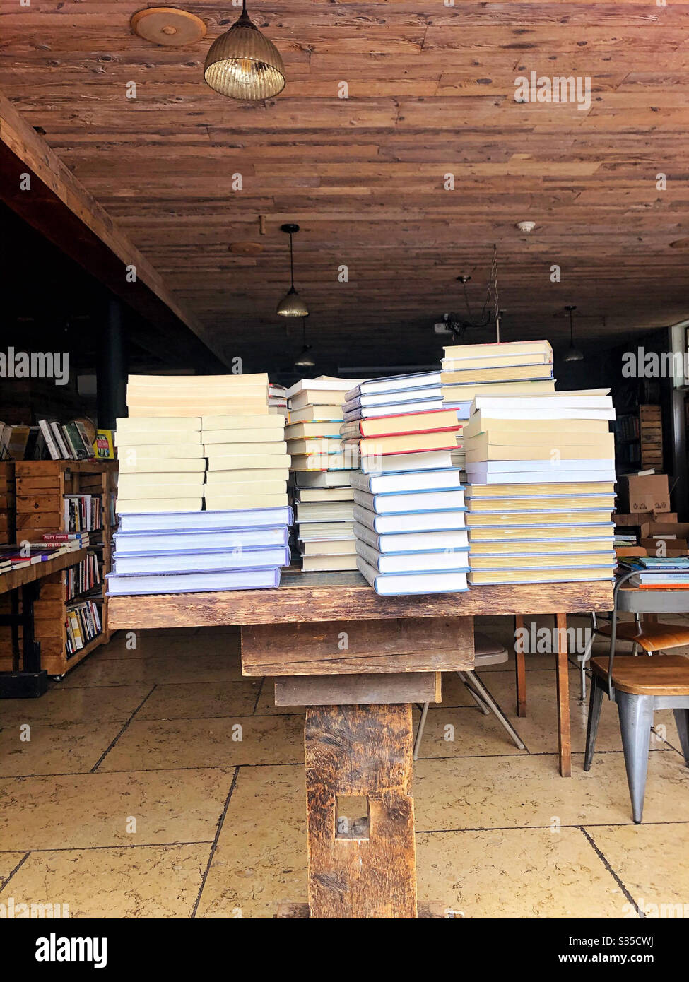 Piles of books for sale in a bookstore or shop - Smartphone Captured Stock Image