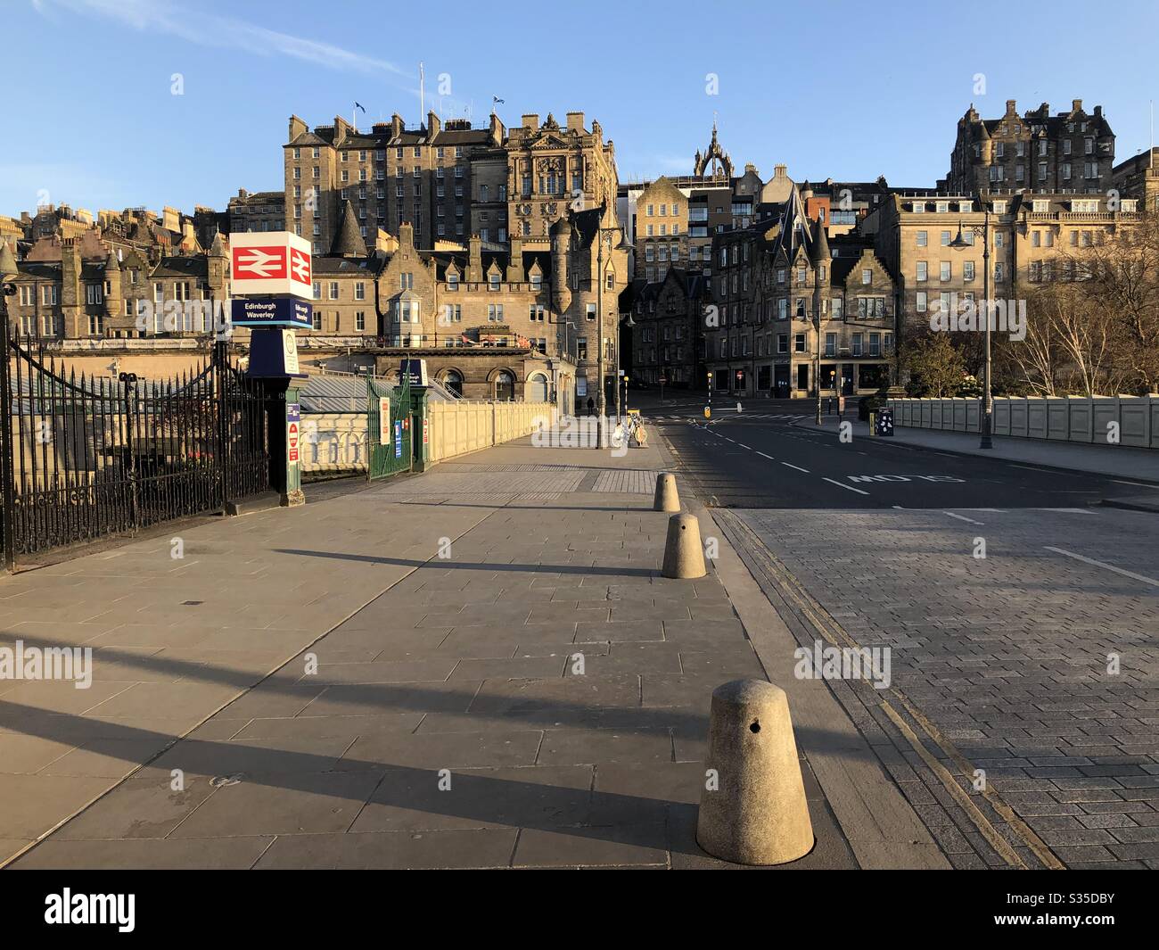 View of Old Town and entrance to Waverley Railway station, Waverley bridge, Edinburgh Stock Photo