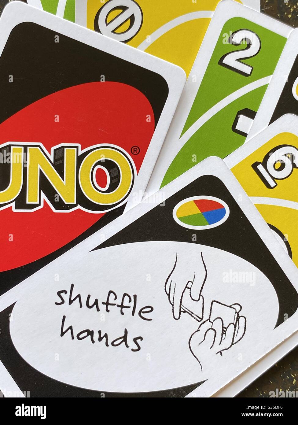 Card game uno with a shuffle hand cards and numbered cards Stock Photo