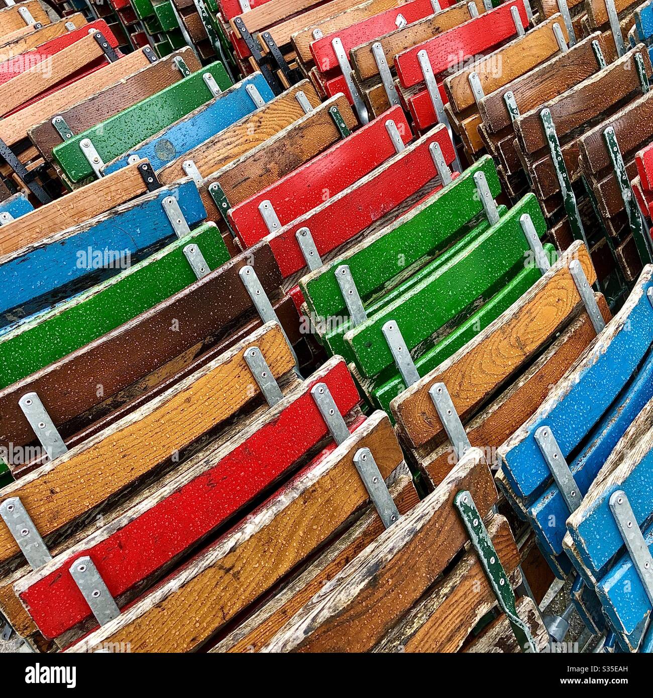 Stacked café chairs during Covid-19 shutdown - Brussels, Belgium. Stock Photo