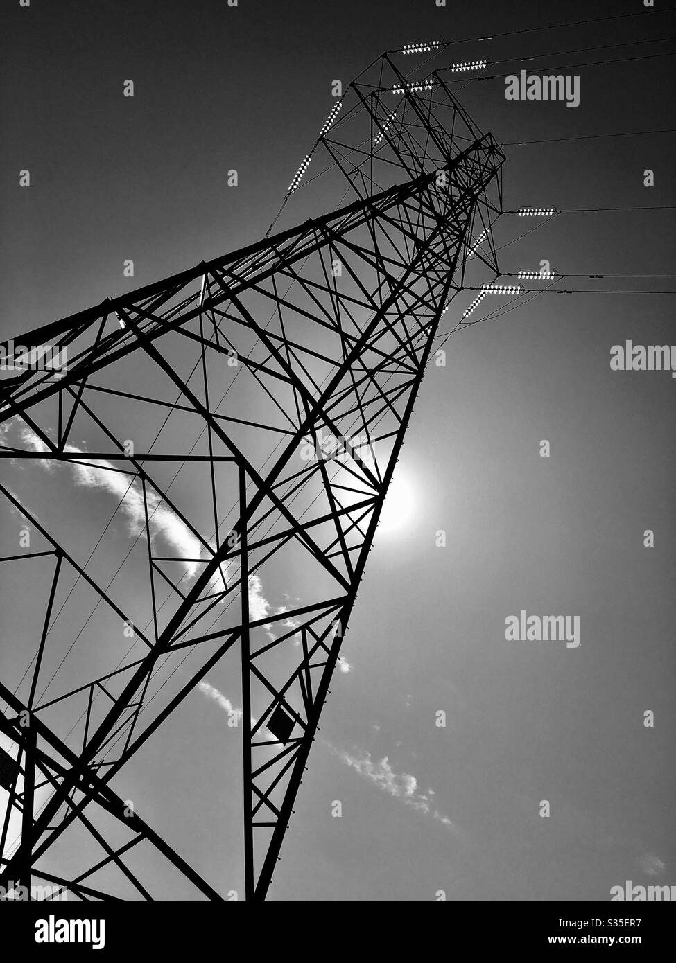Monochrome electricity pylon looking up England UK GB - Smartphone Captured Stock Image