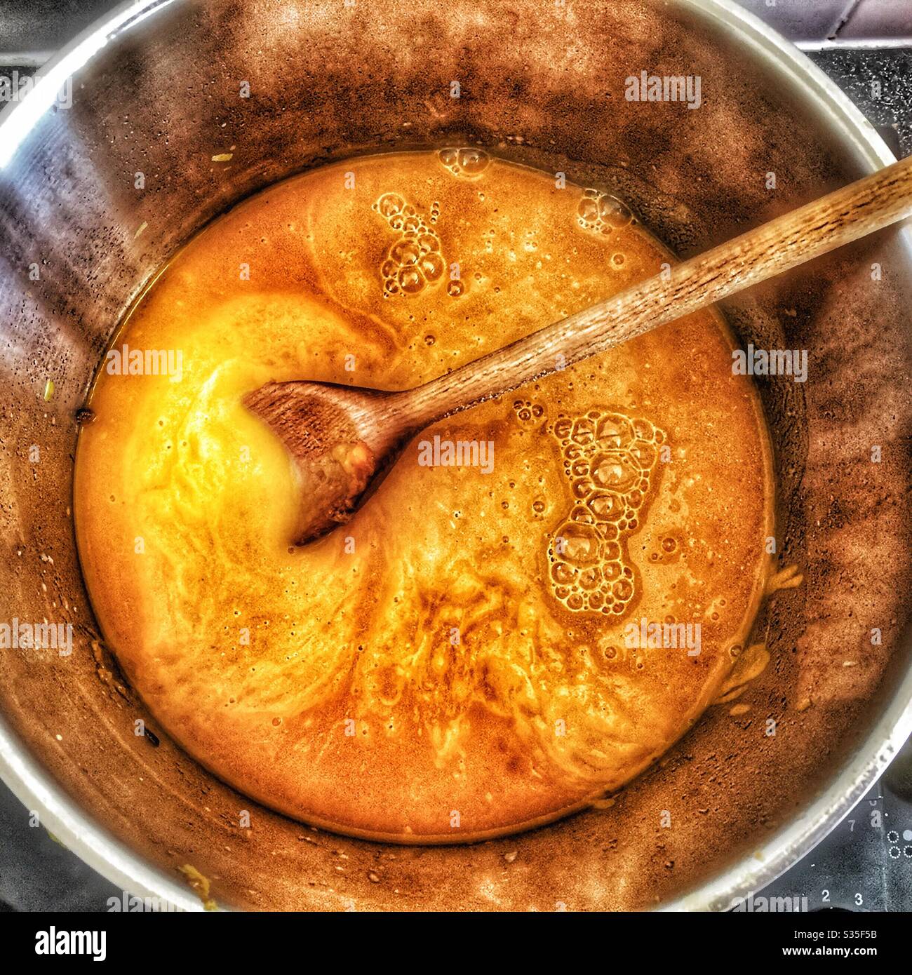 Roasted butternut squash soup homemade in silver saucepan Stock Photo