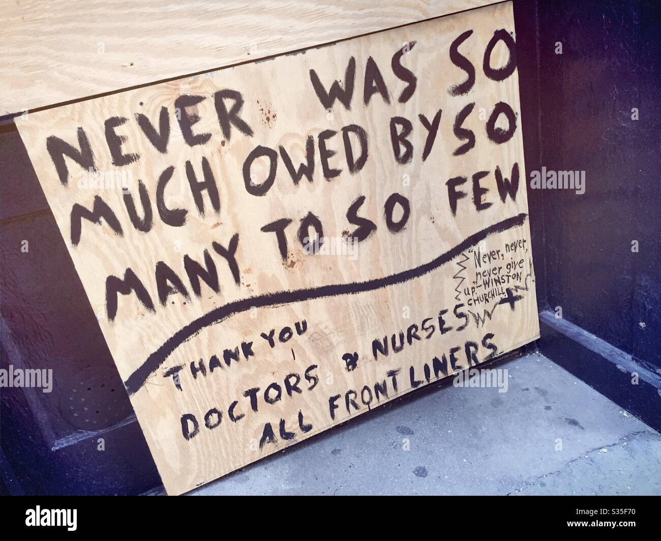 Handpainted salute to the doctors and nurses on a shuttered business in New York City during the pandemic of 2020, NYC, USA - Smartphone Captured Stock Image