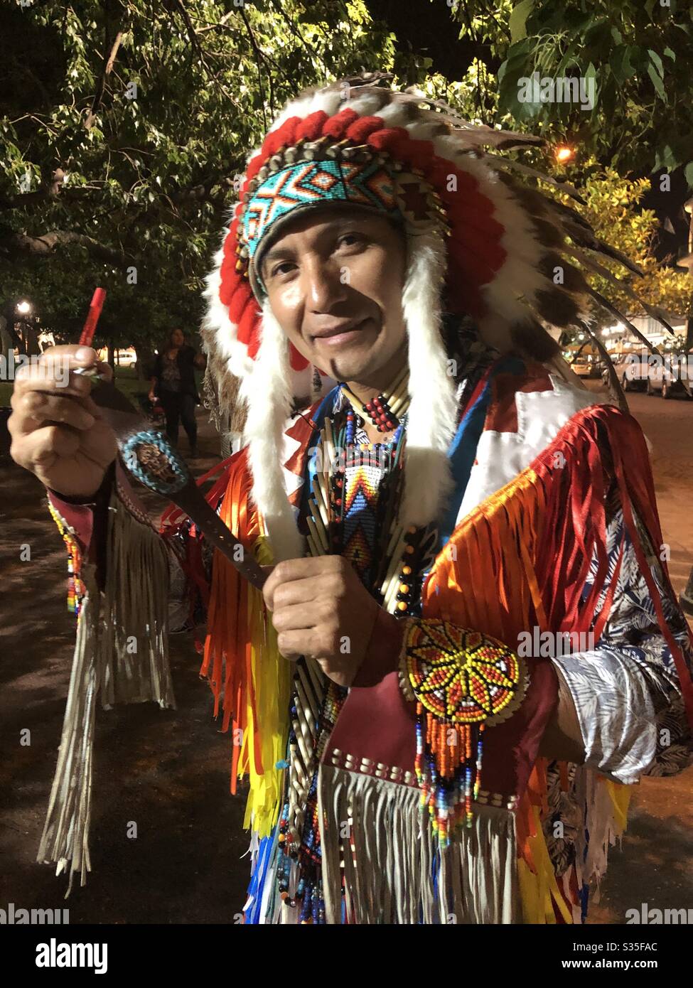 A Peruvian musician dressed in traditional clothing. - Smartphone Captured Stock Image