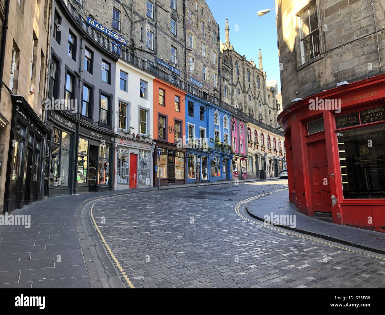 Colourful small shop fronts in Edinburgh’s Victoria Street/West Bow Stock Photo