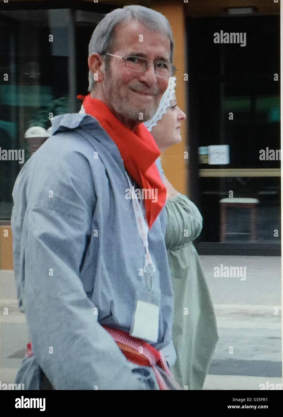 Two people, Two friends, man and woman, walking on the street - Smartphone Captured Stock Image
