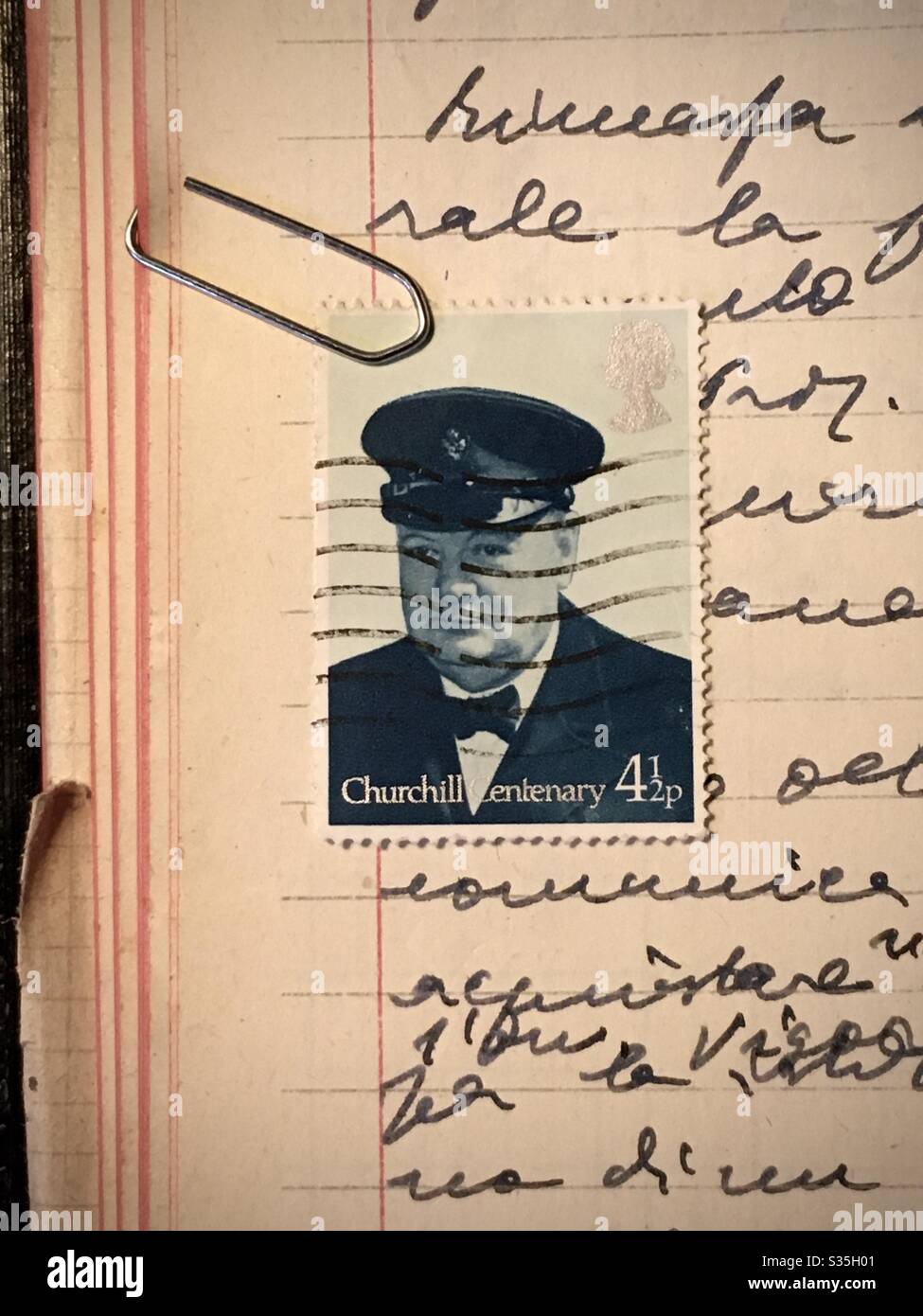 Winston Churchill stamp on a sheet of paper hand written of a notebook Stock Photo