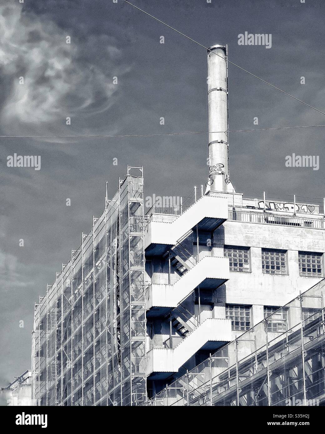 1930s factory with tall chimney - Smartphone Captured Stock Image