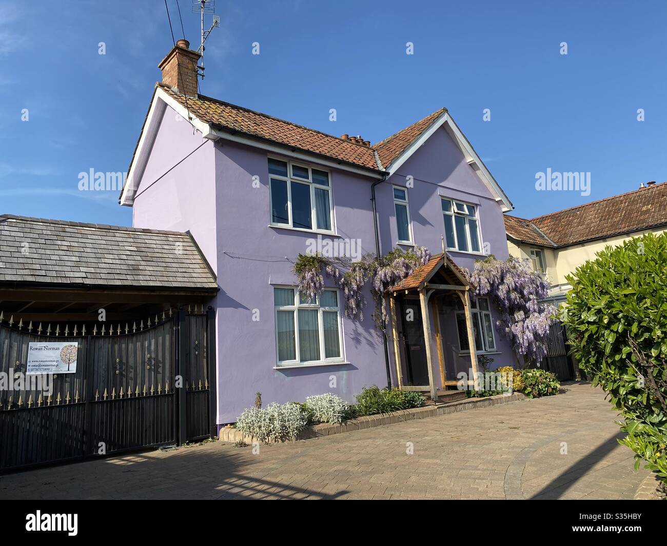 The lilac house, matching house and flowers Stock Photo - Alamy