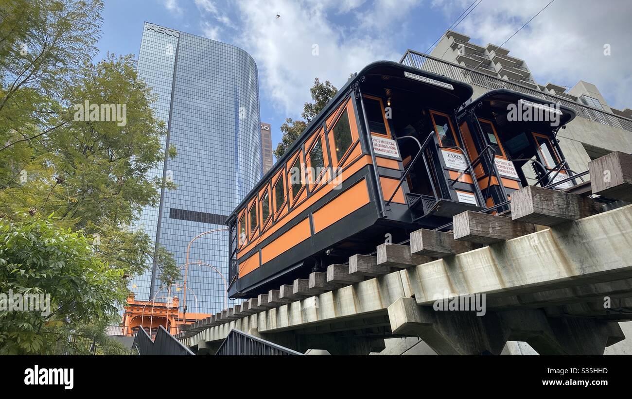 LOS ANGELES, CA, APR 2020: rail cars parked on Angels Flight funicular railway, looking up with skyscrapers in background, Downtown Financial District. Railway closed during coronavirus pandemic - Smartphone Captured Stock Image