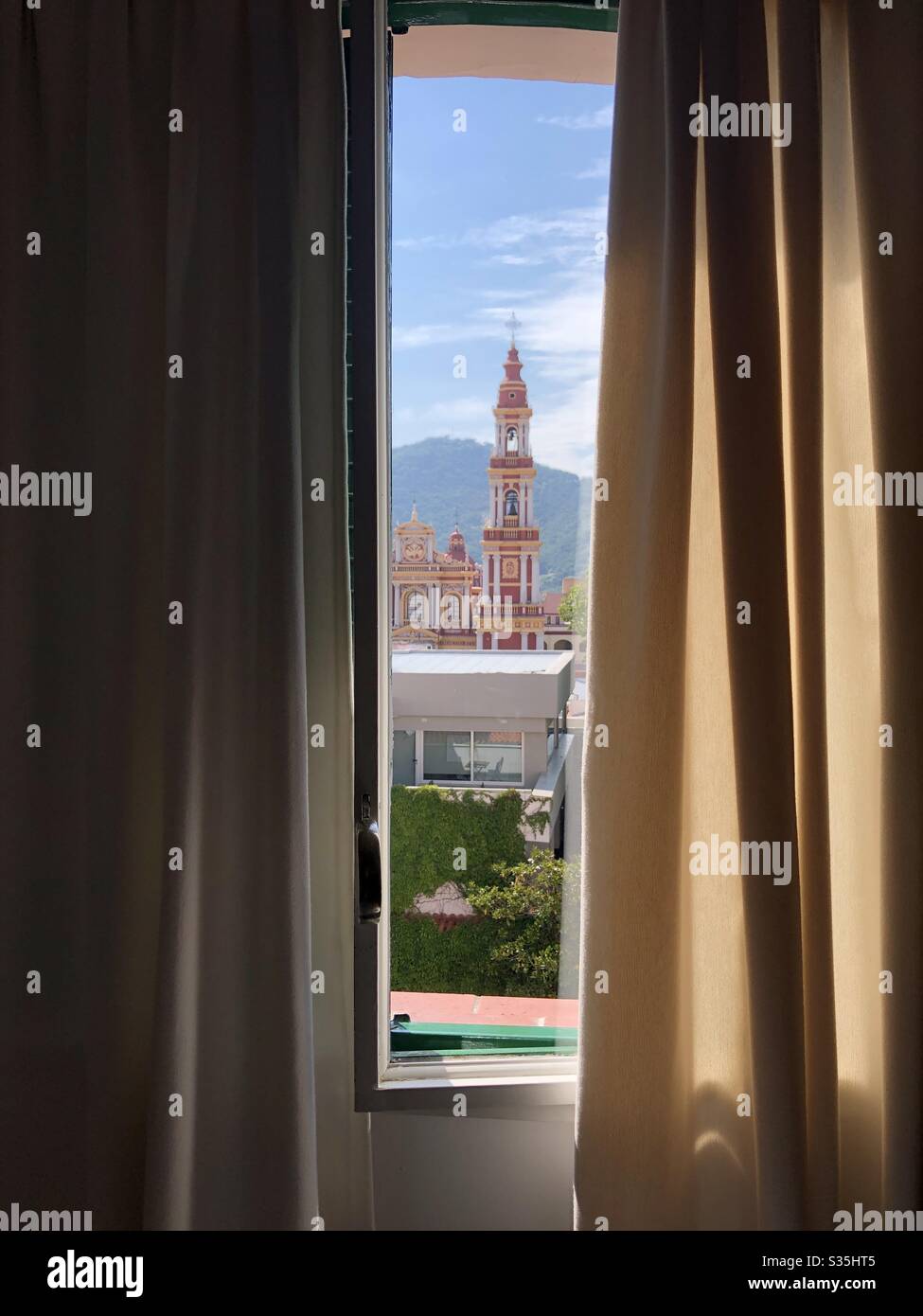 Room with a view of a colonial church in Salta, Argentina. Stock Photo