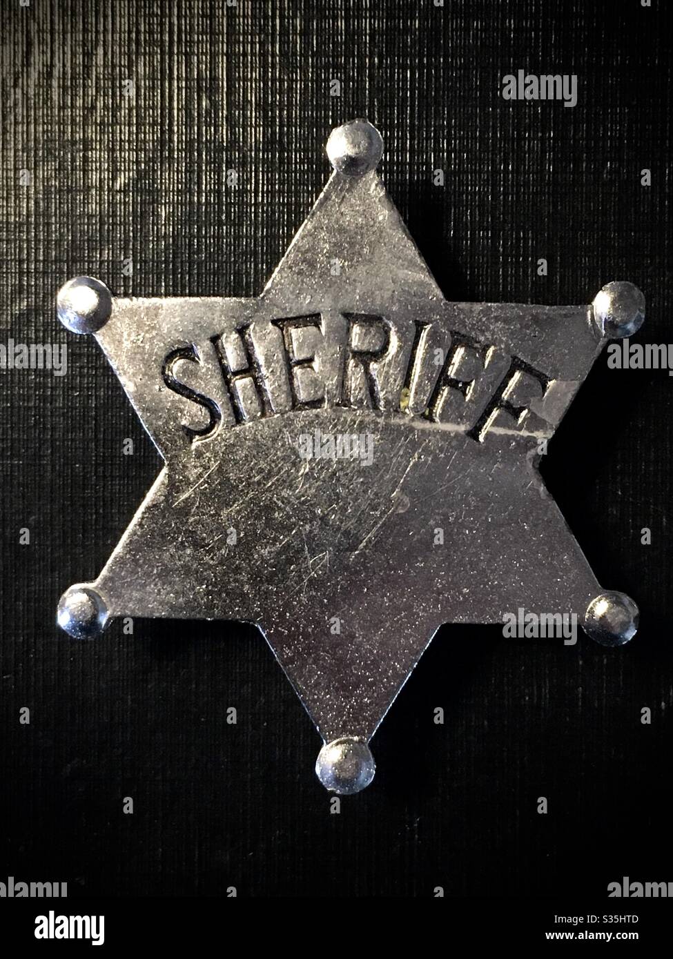 Fake sheriff star badge still life  close up Stock Photo