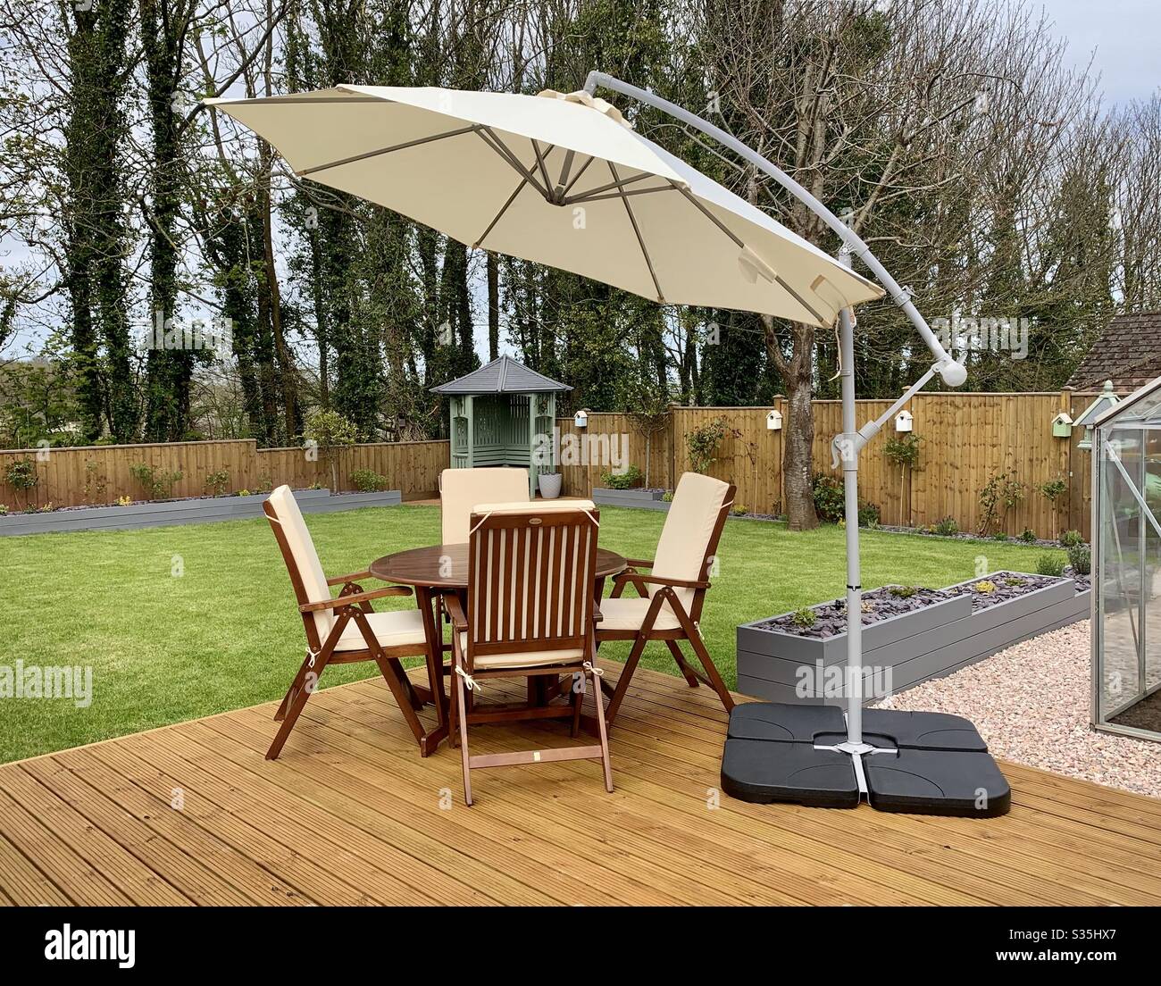 Outdoor furniture set on a deck in the garden Stock Photo Alamy