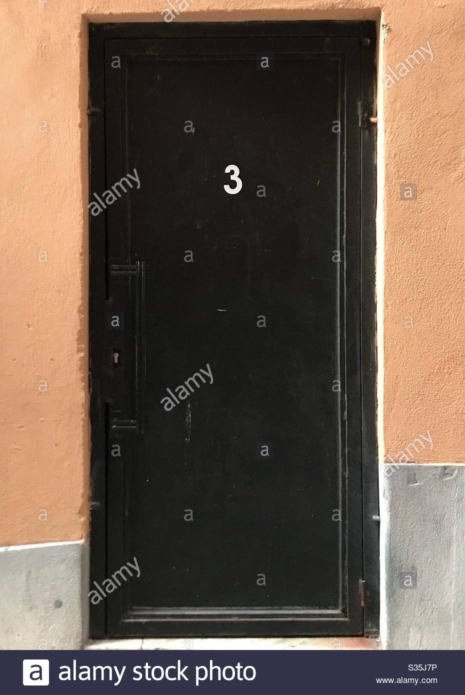 Black metal door number 3
