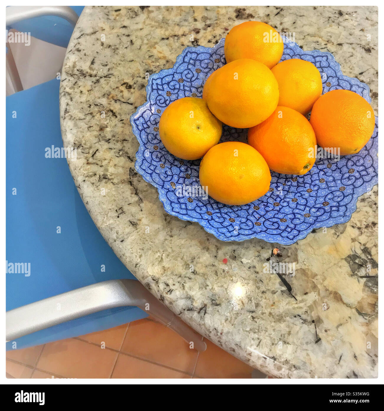 Oranges on kitchen table. Stock Photo