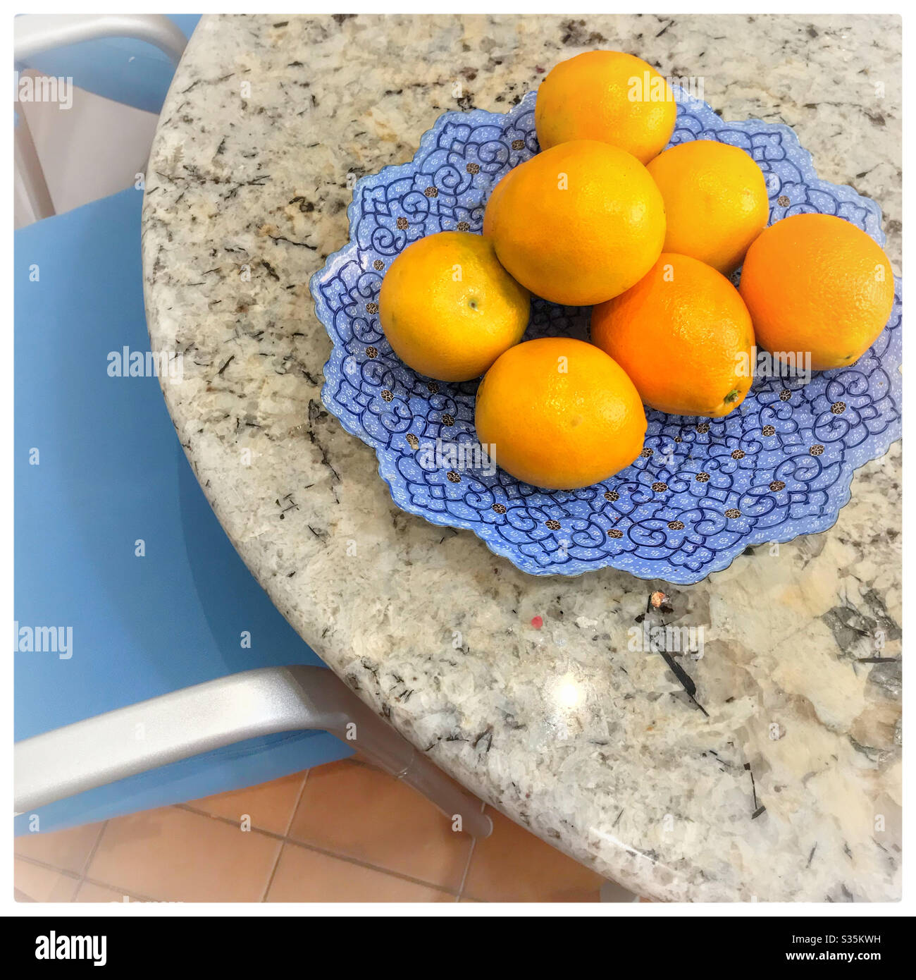 Oranges on kitchen table. Stock Photo