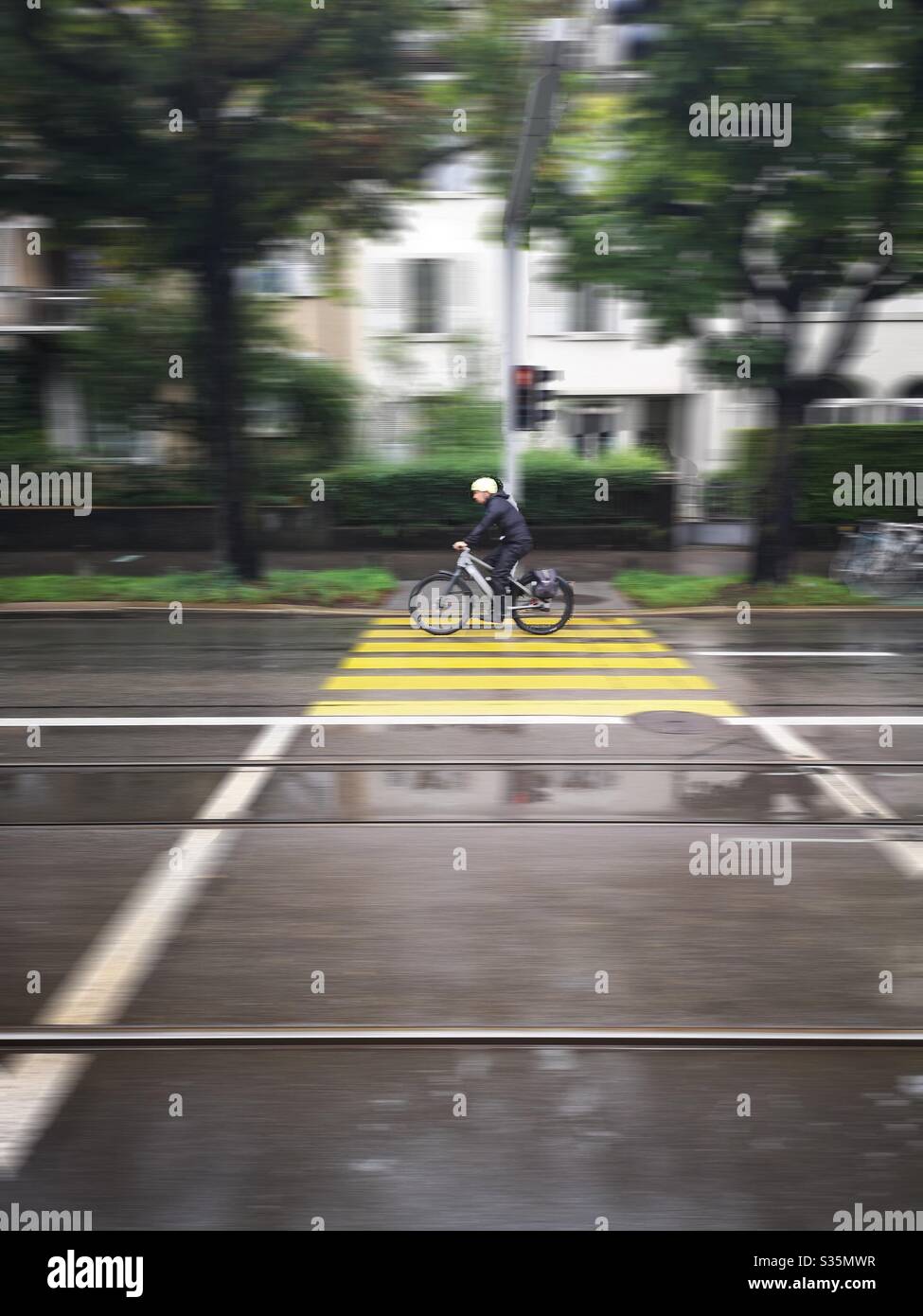 Lone cyclist on quiet city street - Smartphone Captured Stock Image