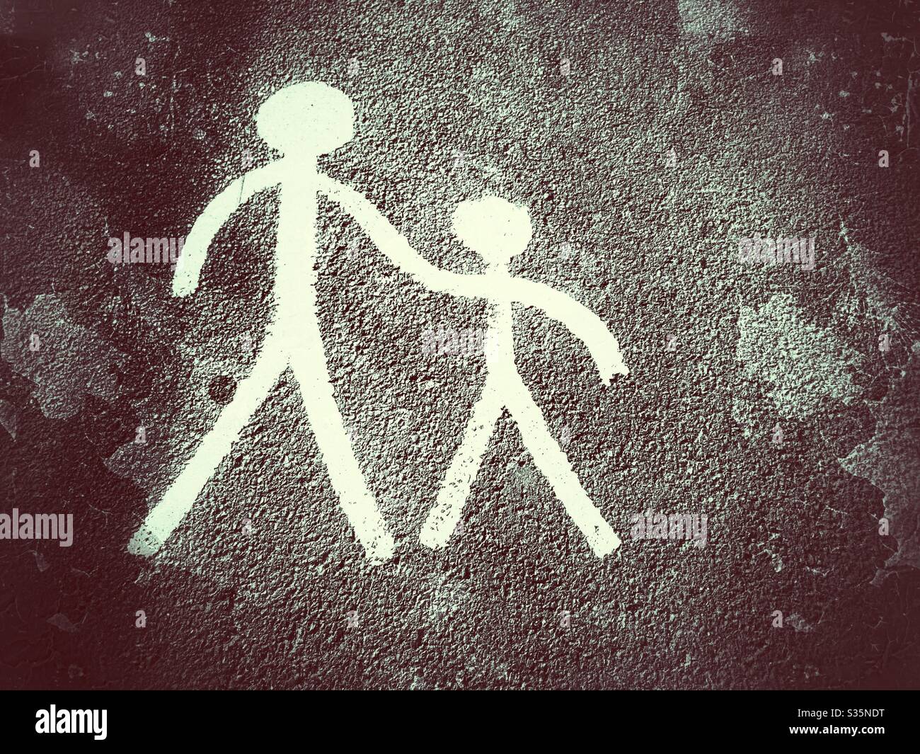 Adult and child pavement markings at a time of social distancing CV-19 - Smartphone Captured Stock Image