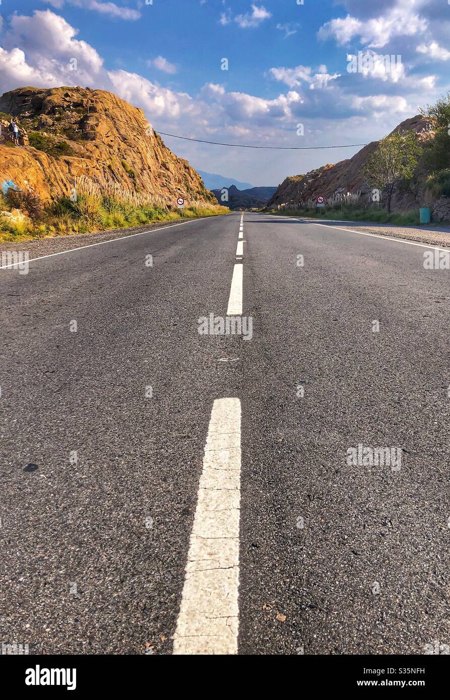 A straight road through the Northern Argentinian landscape. - Smartphone Captured Stock Image