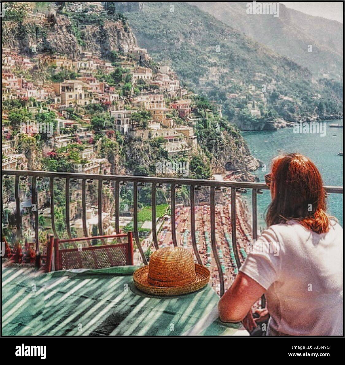 A young woman gazed at the view of Positano in Italy. - Smartphone Captured Stock Image
